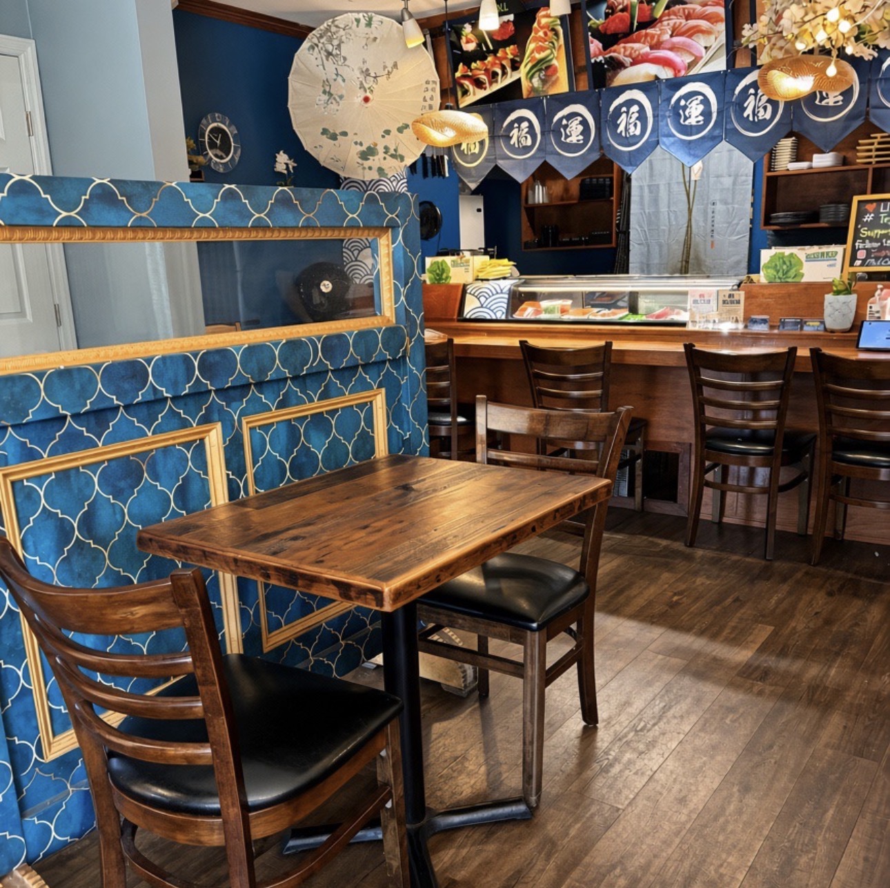 Maki Sushi's blue patterned interior and sushi counter